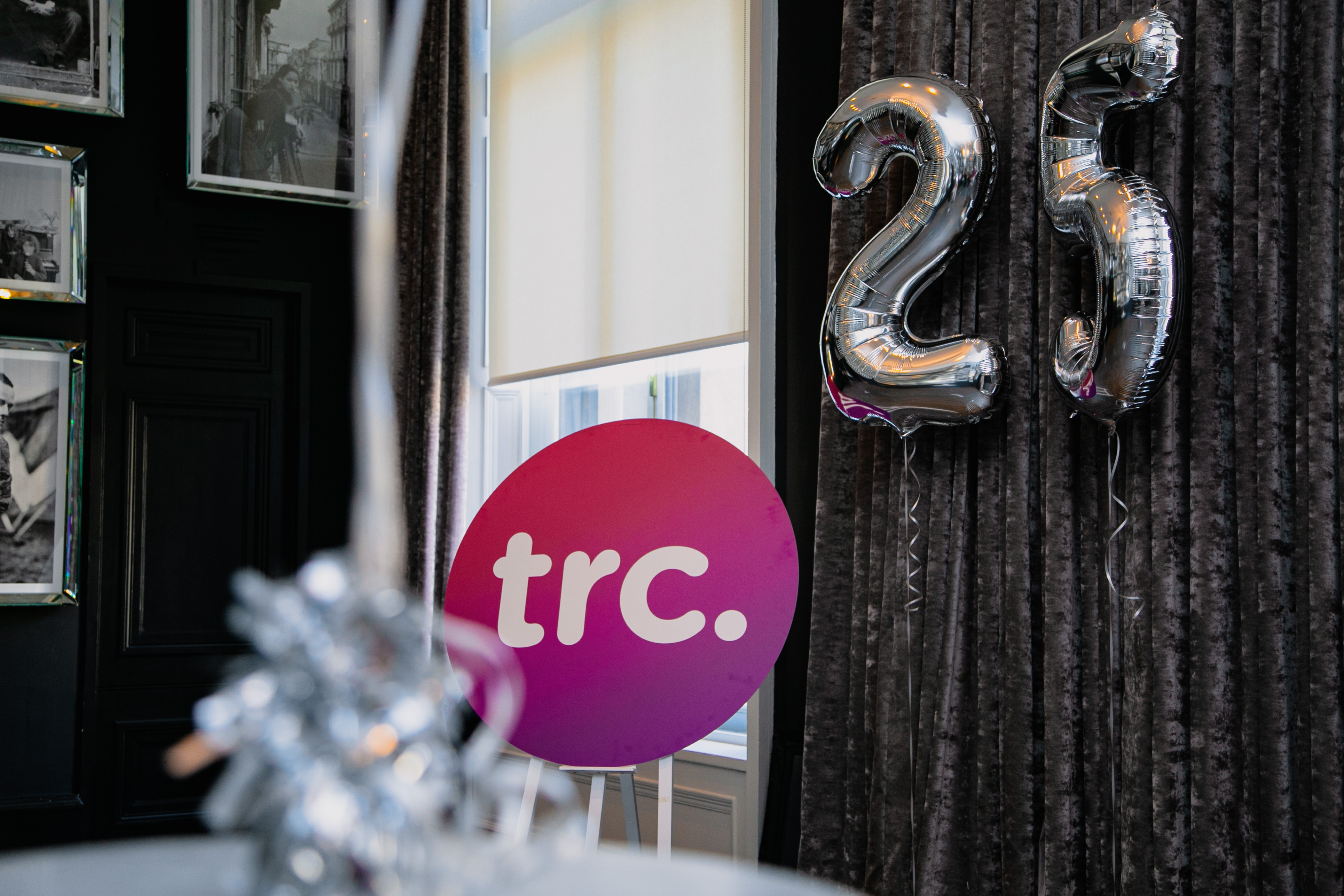 TRC logo and 25 balloons